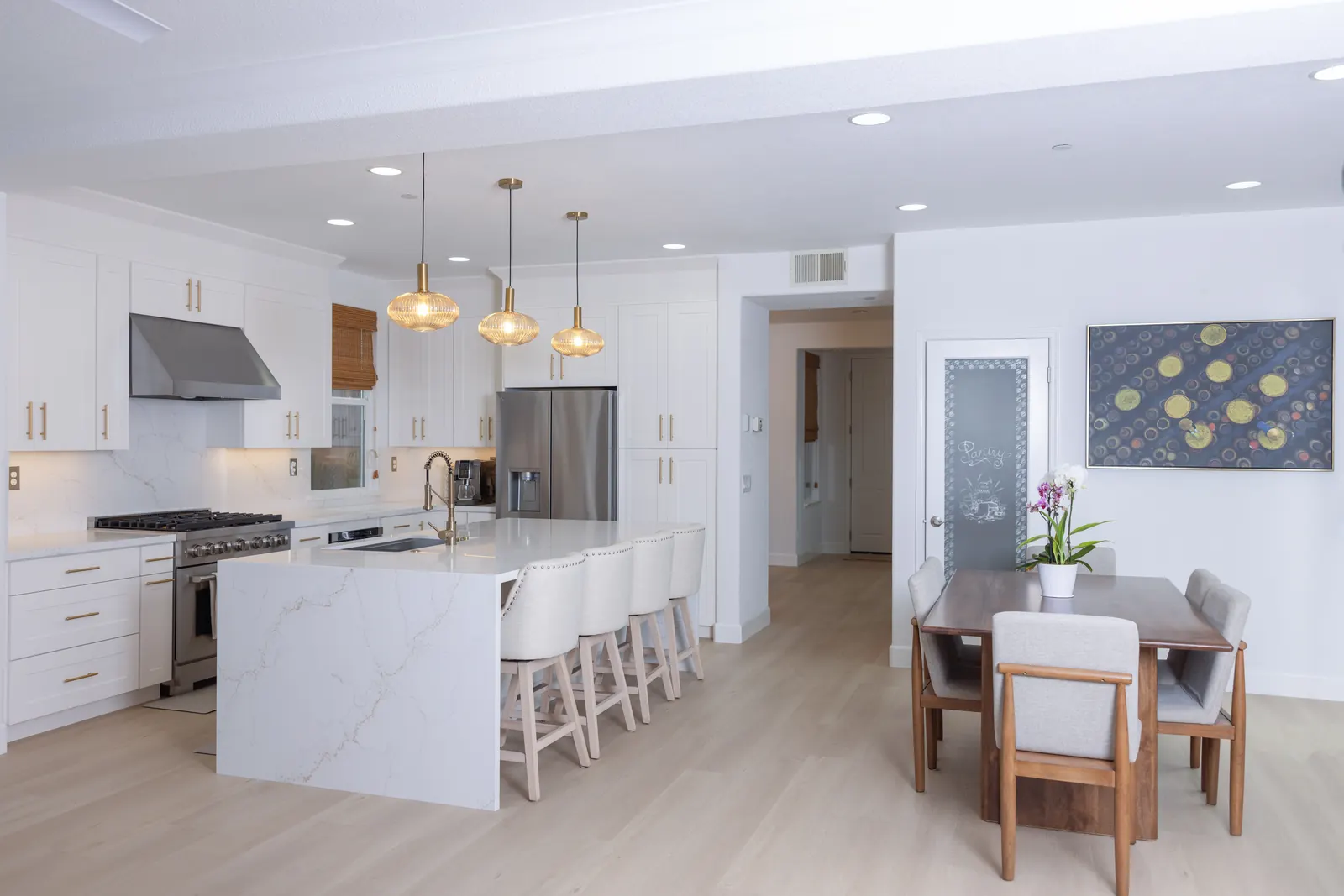 Open kitchen remodel with island and dining area